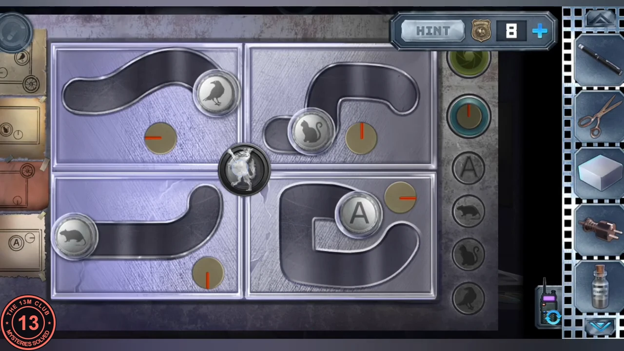 The track board after solving: the raven token at the inner end of the top-left track, the cat at the inner end of the top-right track, the rat at the far left of the bottom-left track, the A token at the inner end of the bottom-right track, and the wolf medallion now in the centre