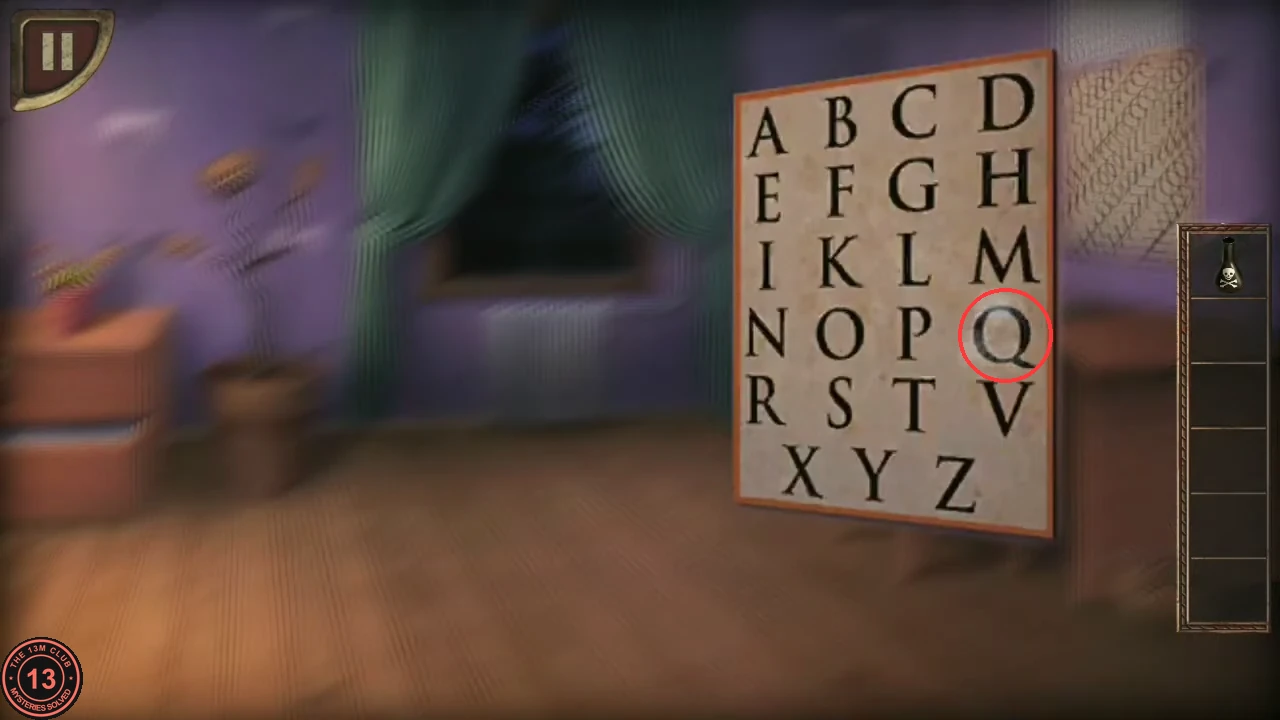 The alphabet poster above the desk with the letter Q circled.