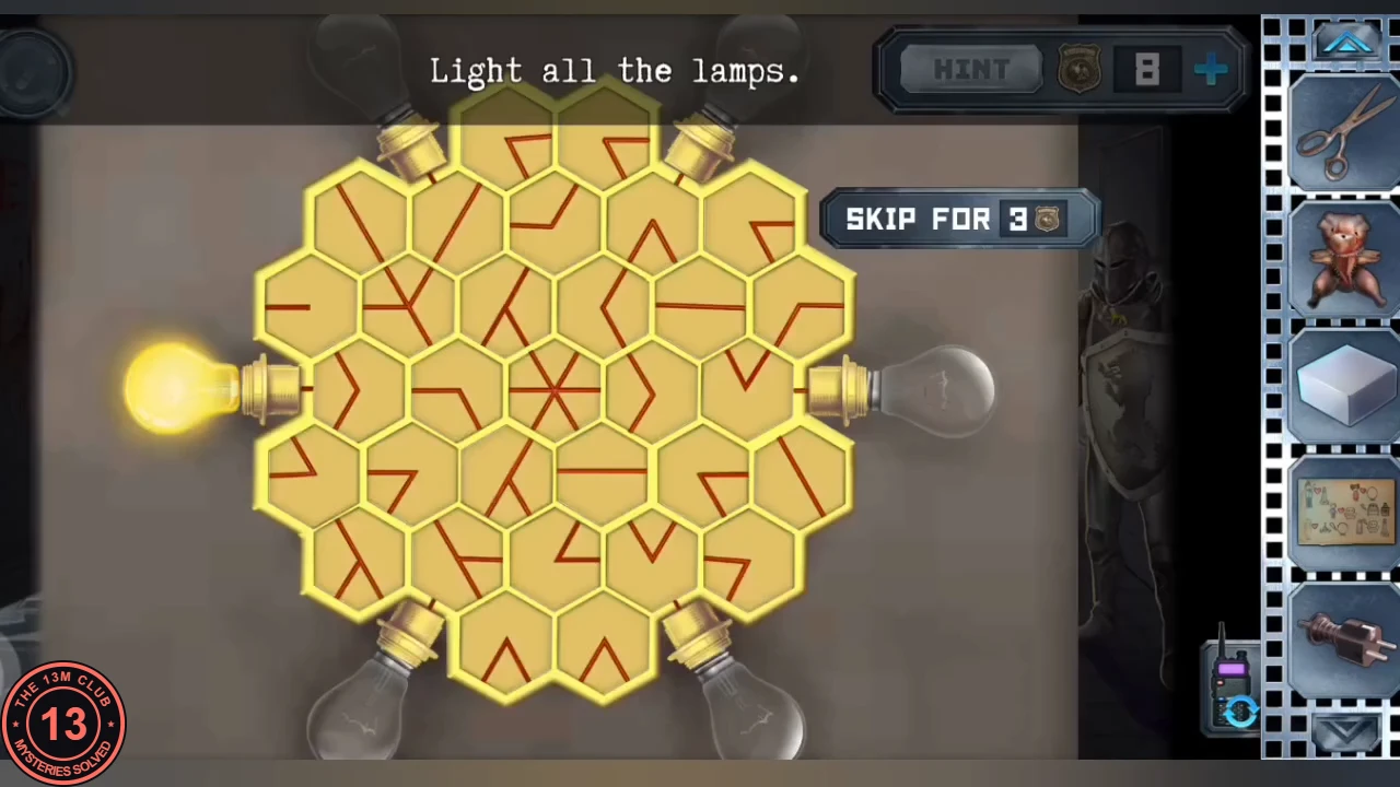 Hexagonal tile board in the museum with red line segments on each tile, one lit bulb on the left and five unlit bulbs around the edge, instruction 'Light all the lamps.'