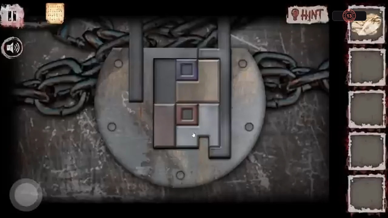 Sliding-block lock on a chained disc, with coloured blocks in a frame and a long dark bar on the right