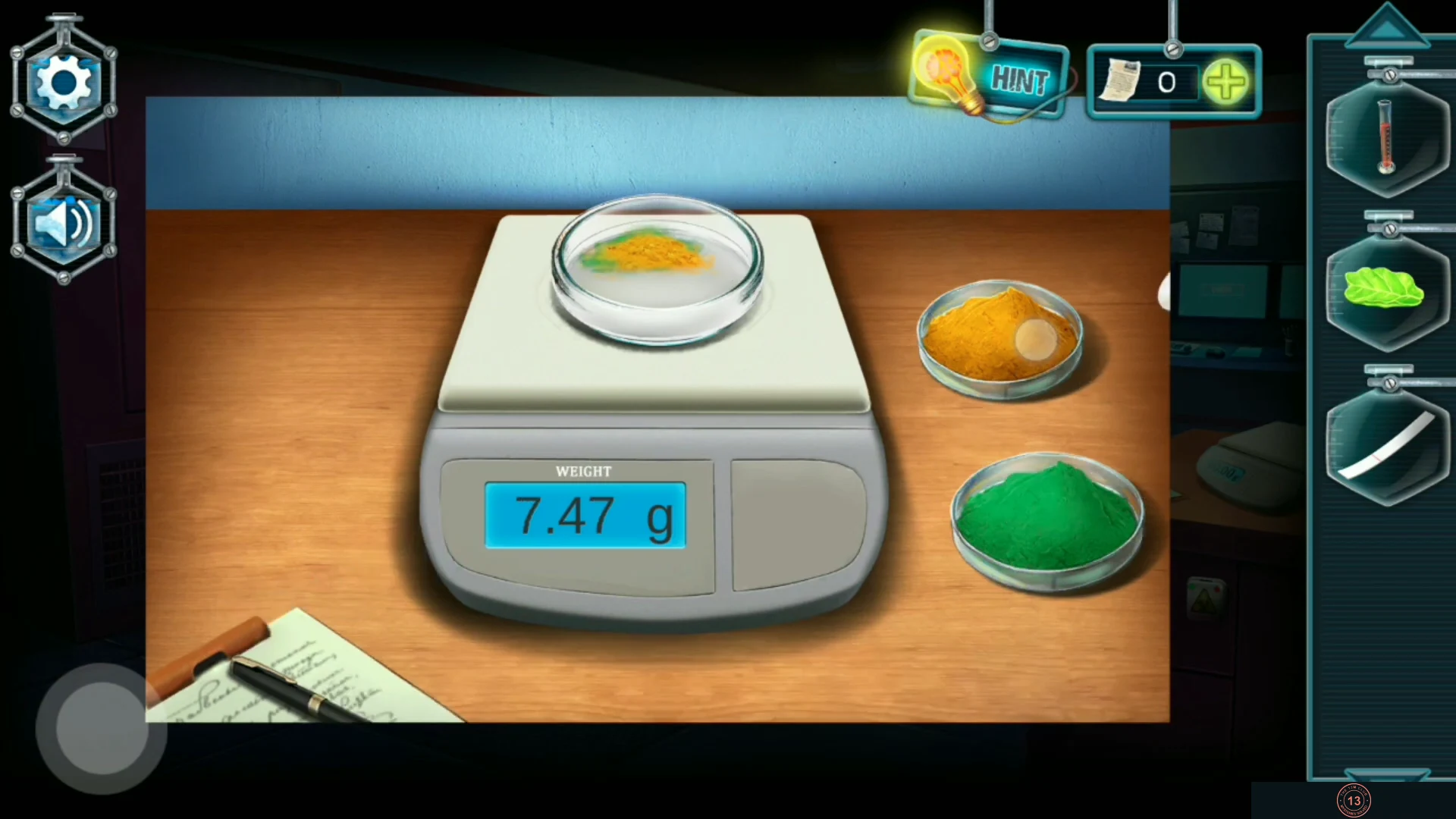 Digital scale part-way through weighing, with dishes of yellow and green powder