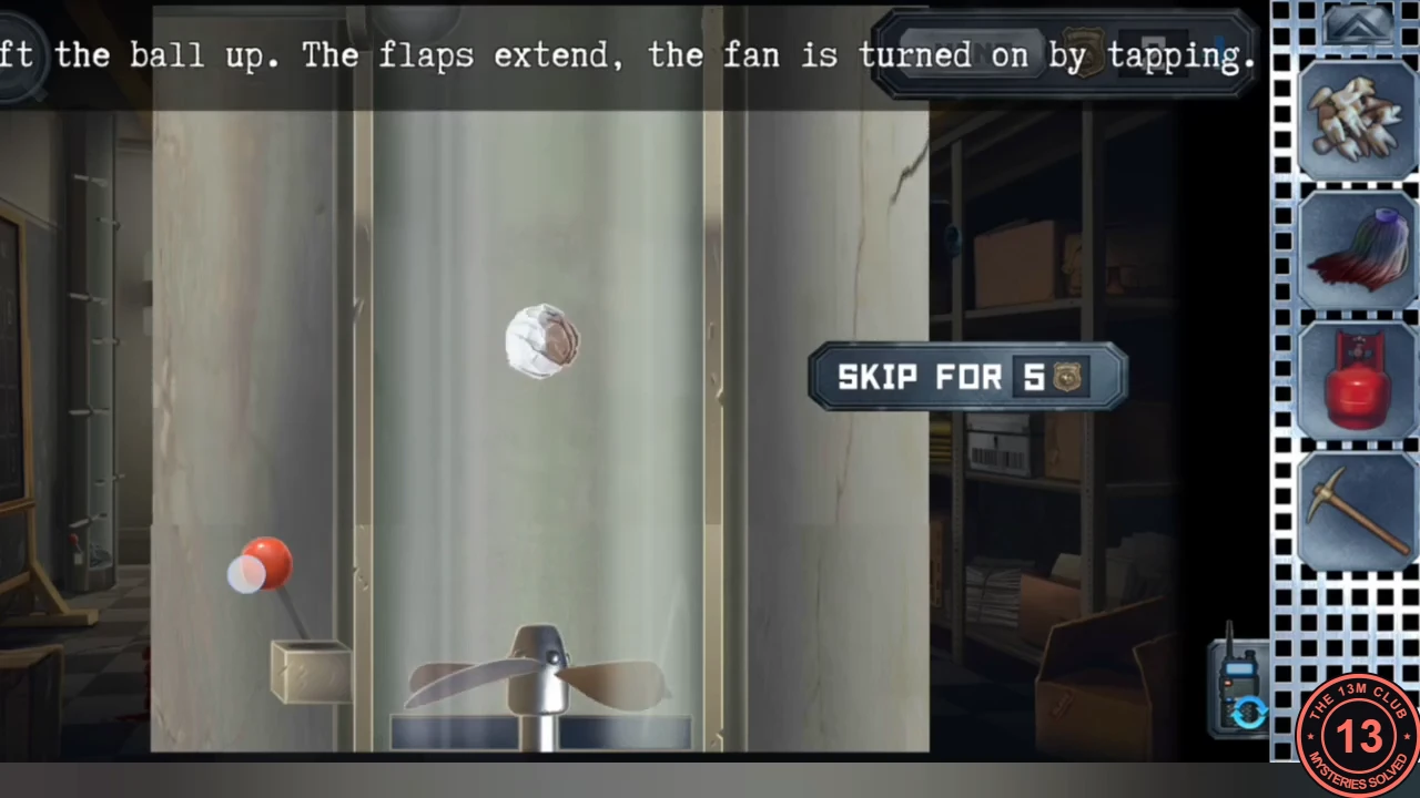 Fan box puzzle in the office showing a paper ball inside a vertical shaft, a fan at the bottom and a red switch on the left