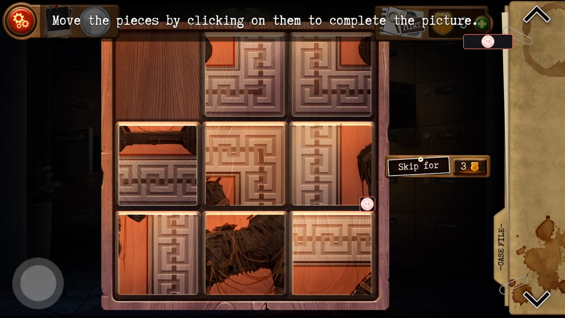 Wooden box with a 3x3 grid of carved tiles in a scrambled order and one empty space in the top-left corner
