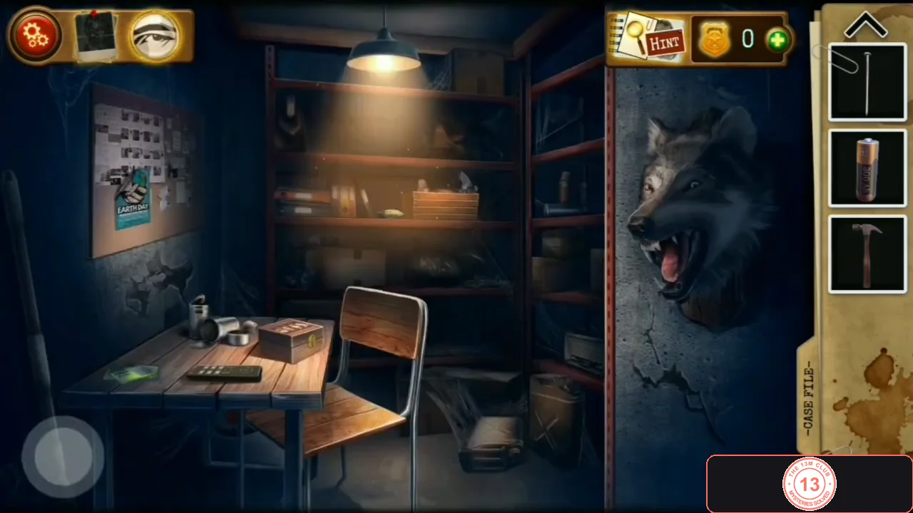 Workshop with a desk, shelves, a toolbox and a wolf head mounted on the right wall